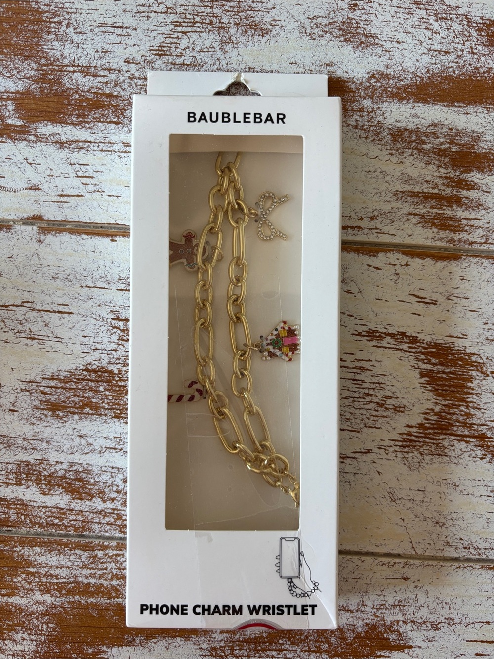 BaubleBar Gold Chain Phone Charm Wristlet with Festive Charms
